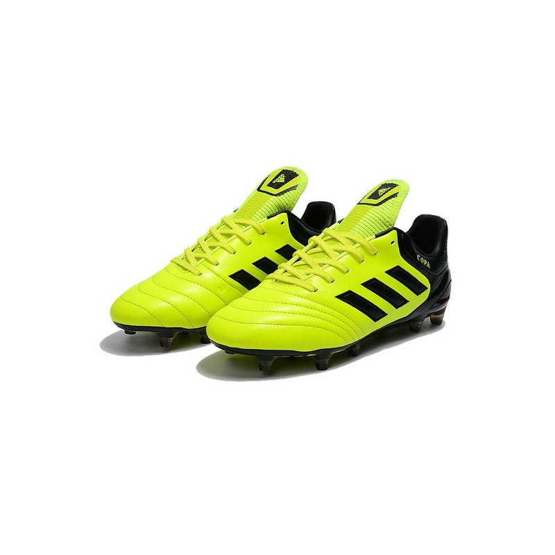 grey and yellow soccer cleats