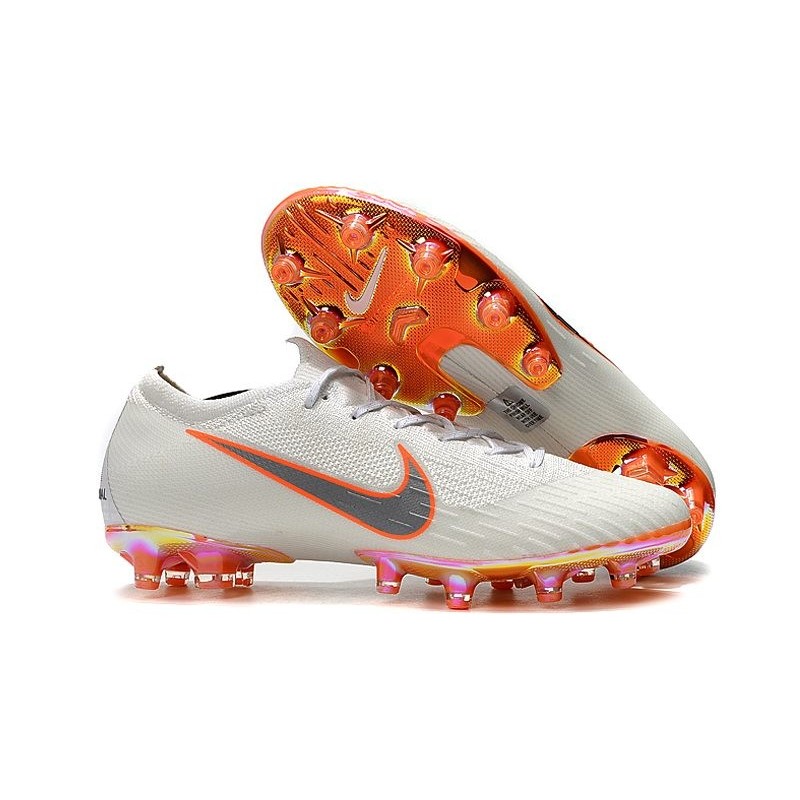 white and orange mercurials