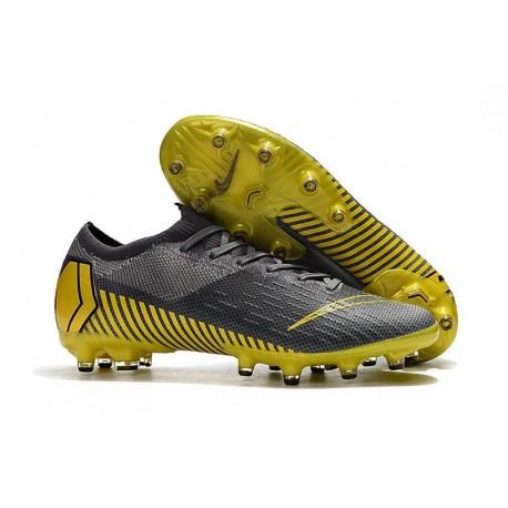 grey and yellow nike boots