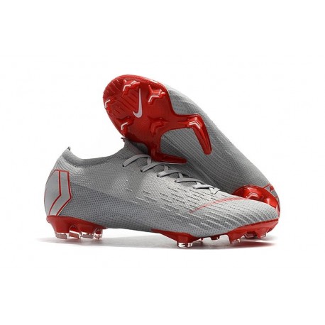 grey and red football boots