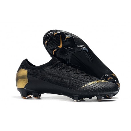 black and gold nike cleats