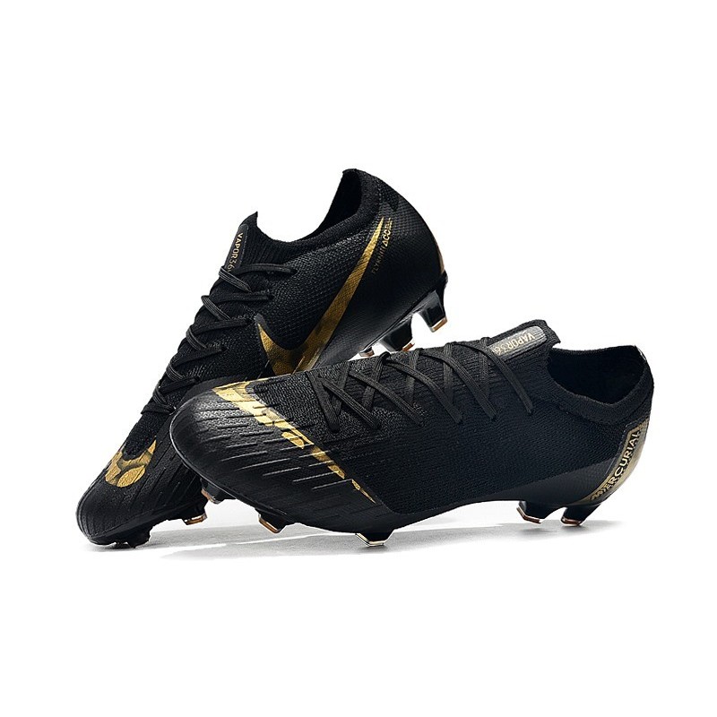 nike black and gold boots